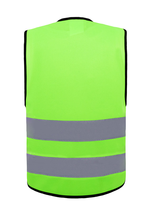 Young smiling girl in signal yellow Korntex safety vest with reflective stripes and zip fastener standing in the park