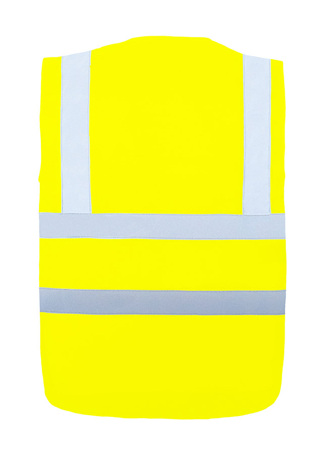 Adult in orange Korntex safety vest with four reflective stripes standing in an industrial environment